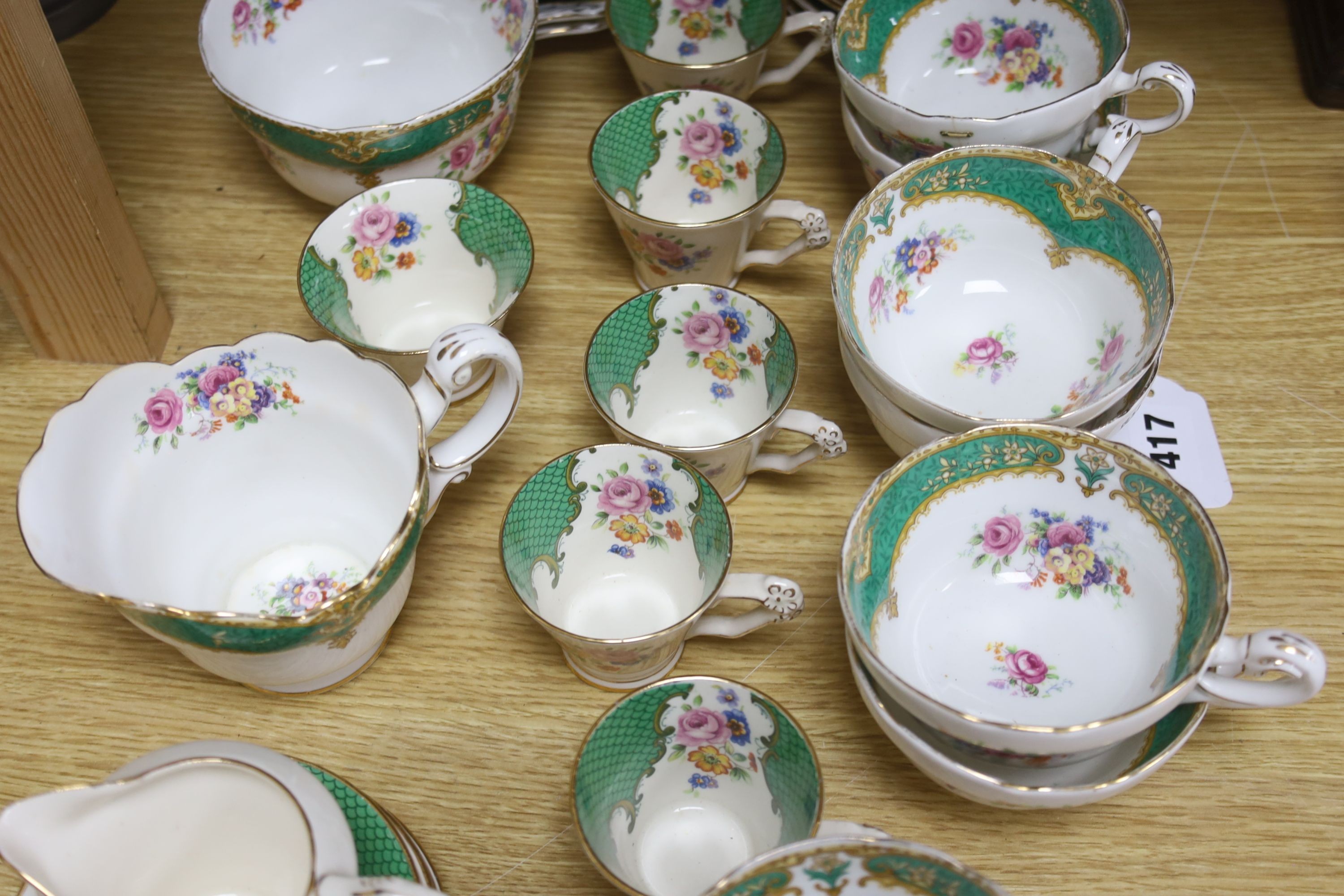 A quantity of Paragon bone china 15 piece part tea and coffee set and two Victorian green glazed wicker effect plates